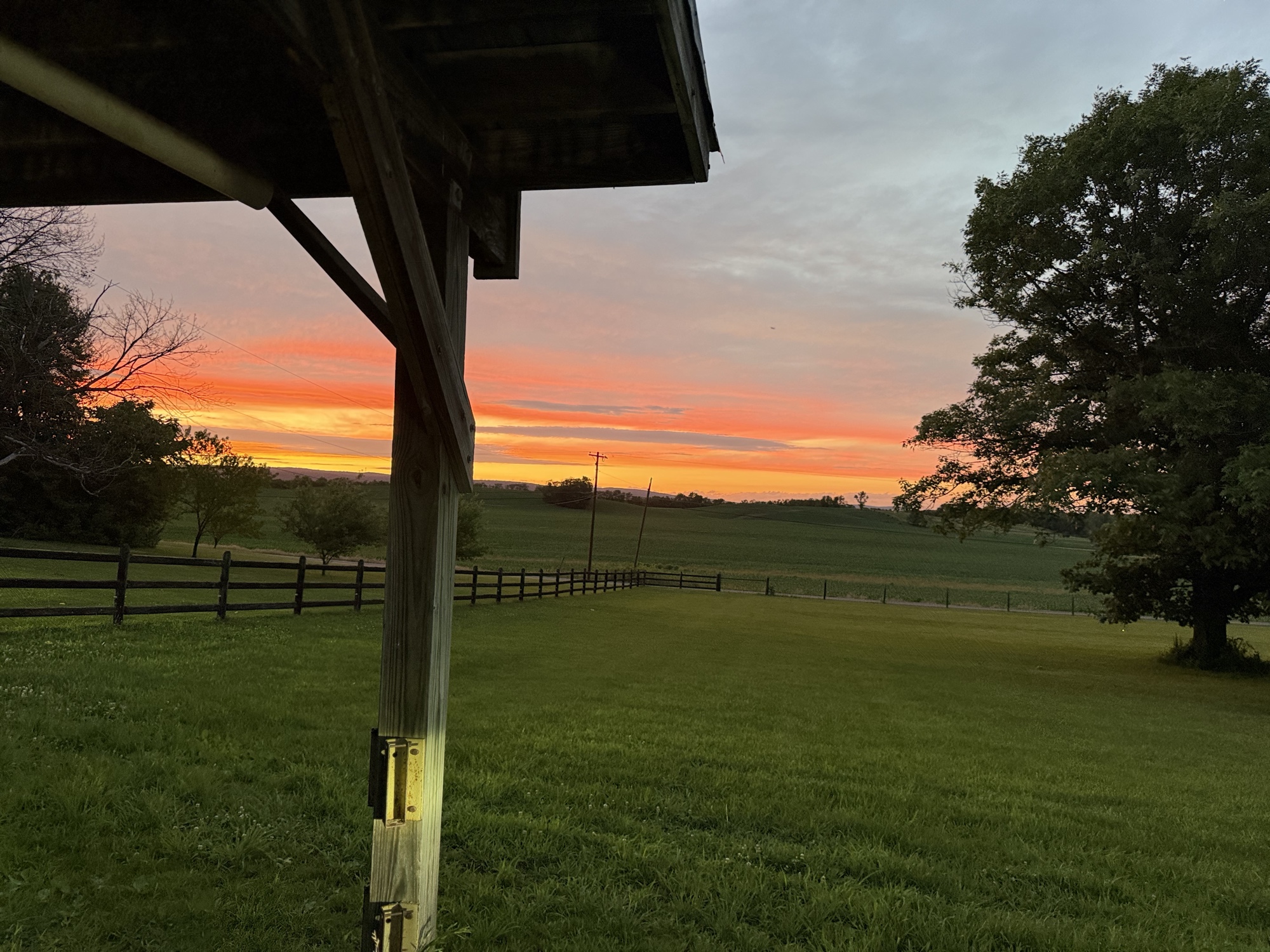 Barn porch glowing at sunset